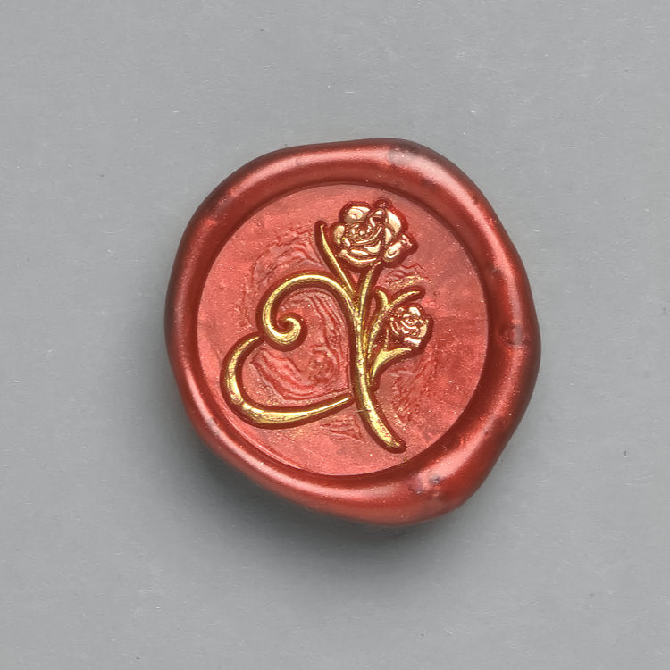 Premium-Wachssiegel mit dem Motiv „Herz mit Rose“ in Rot. Perfekt für Valentinskarten.